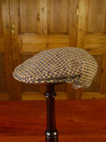 25/0836 brown gun check harris tweed flat cap 56 cms