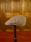 25/0836 brown gun check harris tweed flat cap 56 cms